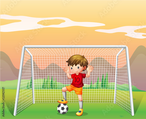 A soccer player in a red shirt