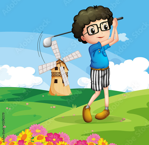 A boy playing golf