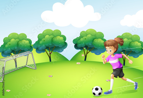 An athletic girl playing soccer