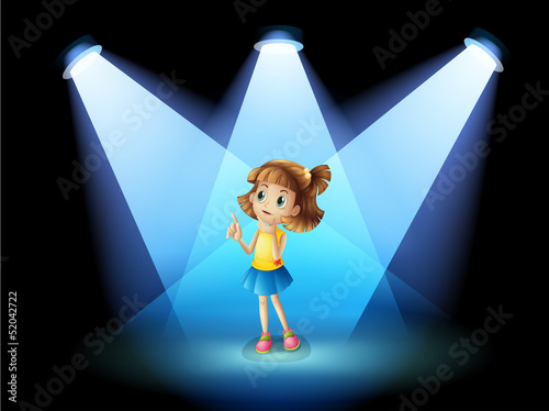 A girl standing in the spotlight