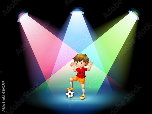A soccer player at the stage with spotlights