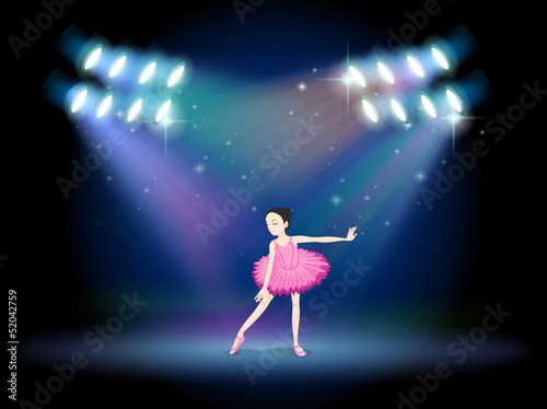 A young girl dancing ballet with spotlights