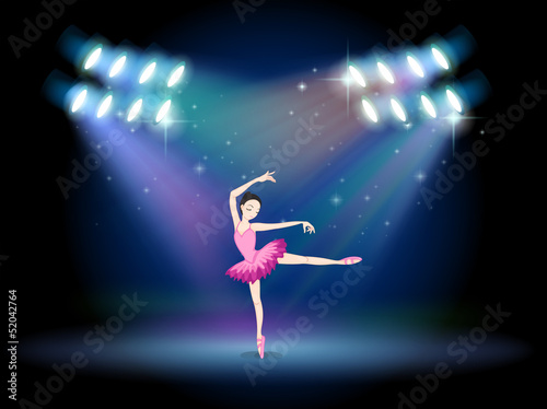 A woman dancing ballet with spotlights
