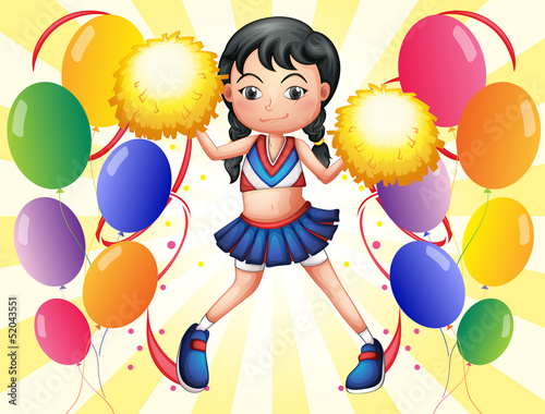 A young cheerer in the middle of the balloons