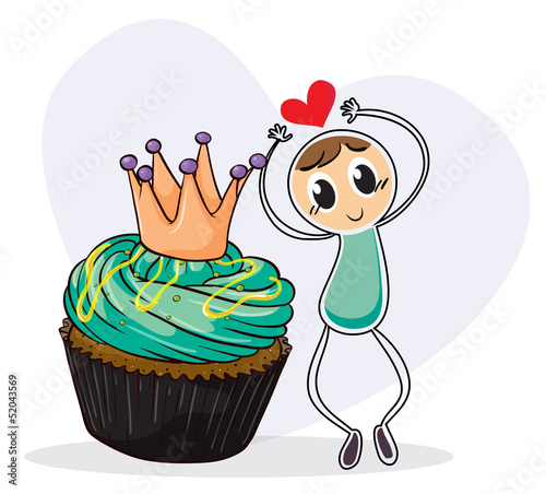A boy dancing beside a cupcake