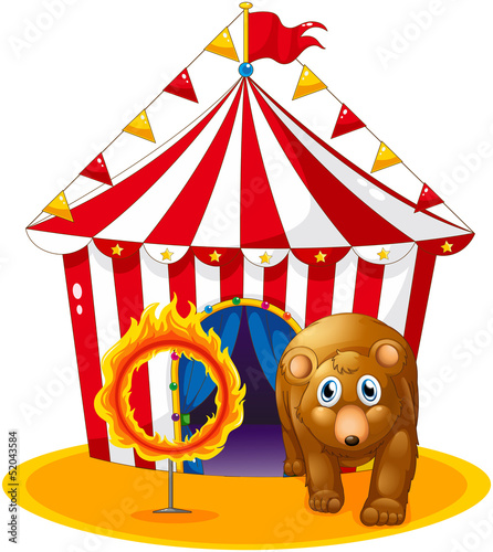 A red tent at the back of a bear and a flaming ring