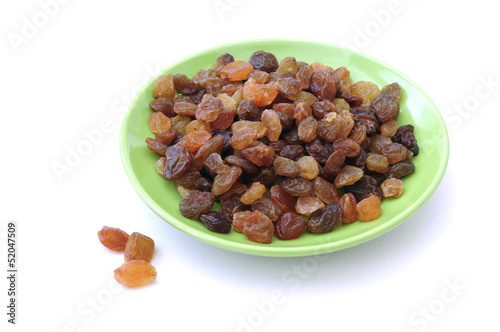 raisins on a plate isolated
