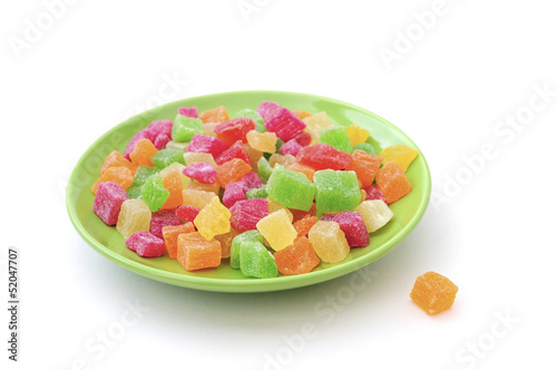 candied fruit on a plate isolated