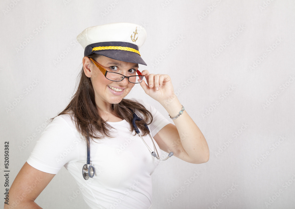Smiling female doctor, leader of medical crew on luxury cruiser Smiling female doctor, leader of medical crew on luxury cruiser