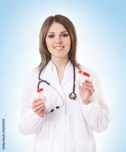 Young attractive female doctor isolated on white