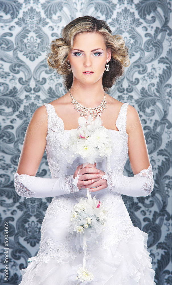 Young, beautiful and emotional bride with flowers Young, beautiful and emotional bride with flowers