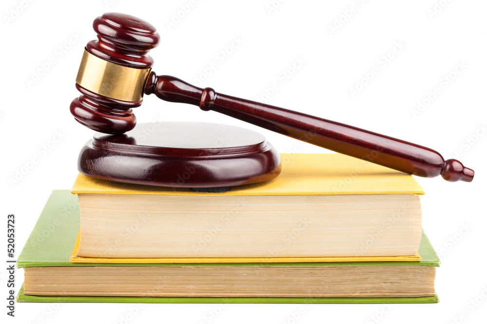 Wooden brown gavel on books Wooden brown gavel on books