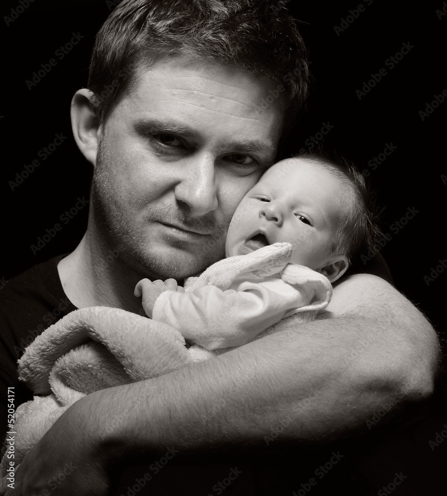 Father and his newborn baby.