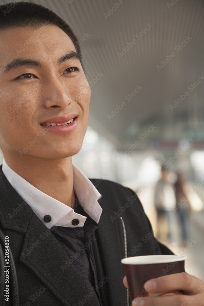 custom made wallpaper toronto digitalYoung Man Drinking Coffee on Train Platform