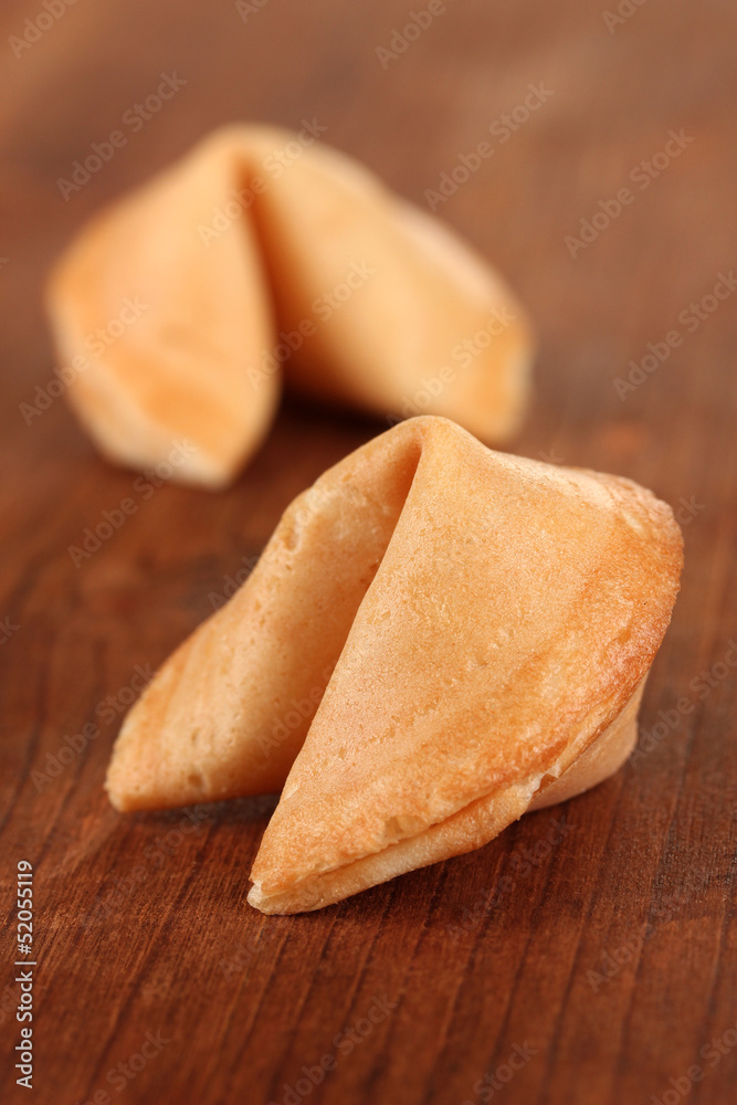 Fortune cookies on wooden table Fortune cookies on wooden table