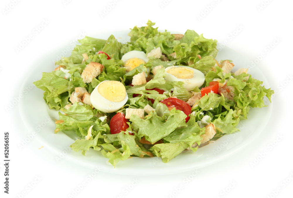 Caesar salad on white plate, isolated on white