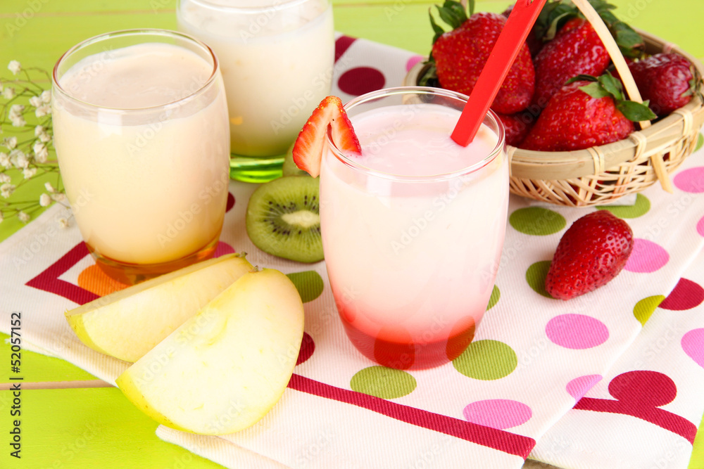 Delicious yogurts with fruits in glasses Delicious yogurts with fruits in glasses
