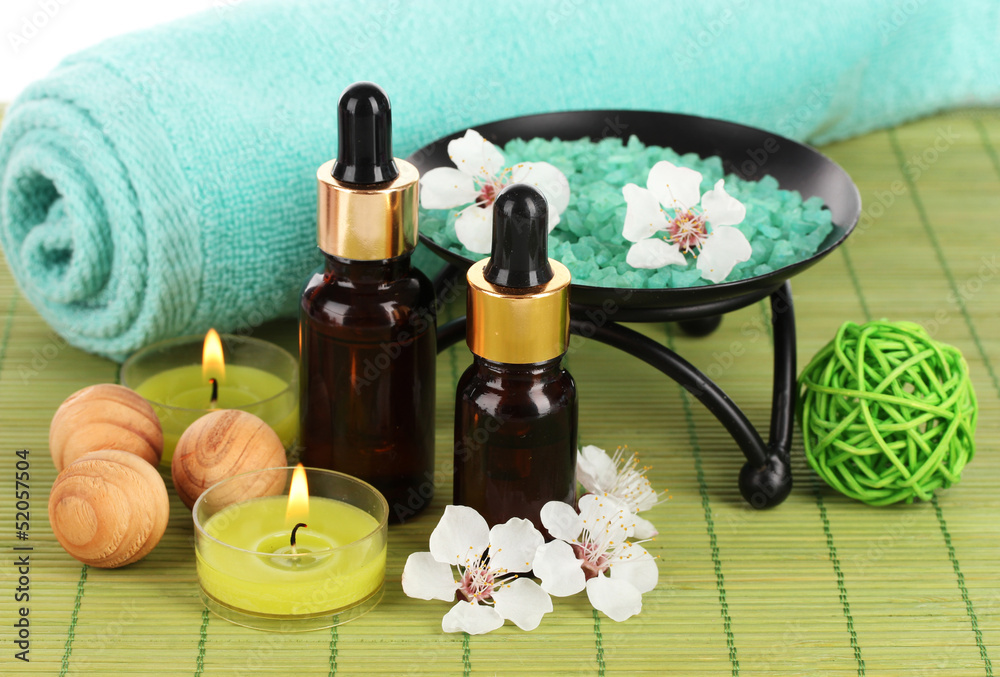 Spa composition with aroma oils on table close-up Spa composition with aroma oils on table close-up
