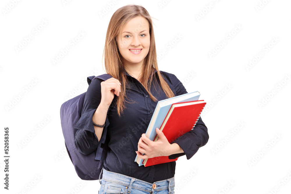A female student with backpack holding notebooks A female student with backpack holding notebooks