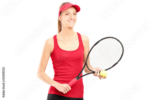 A smiling female holding a tennis racket and a ball © Ljupco Smokovski
