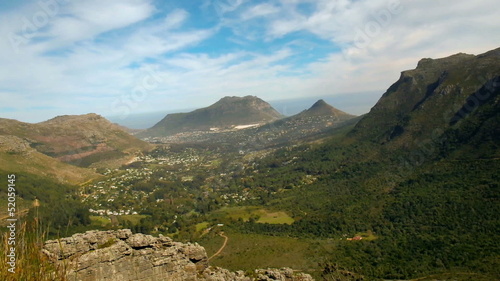 green grassy rocky hill, table mountain, south africa