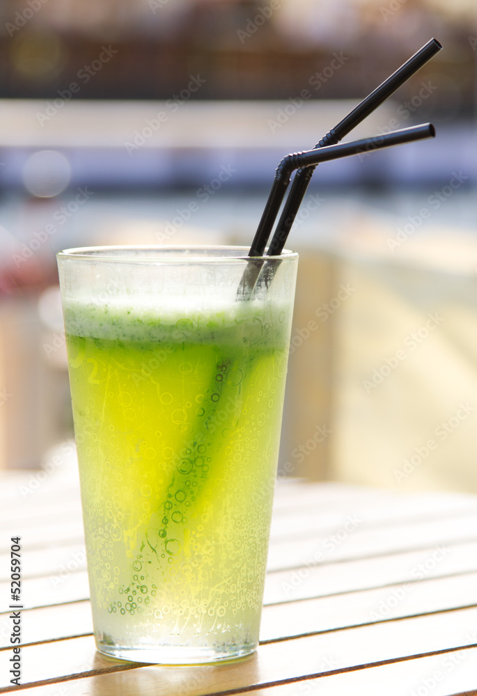 Glass of lemonade with green fresh mint in the sun Glass of lemonade with green fresh mint in the sun