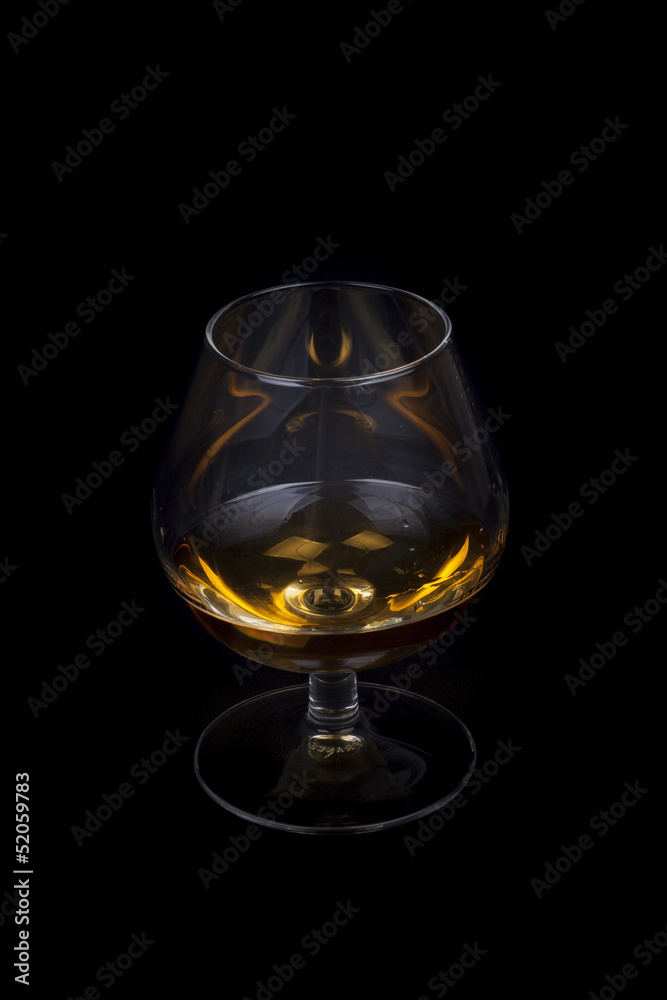 Pouring cognac into a Glass.