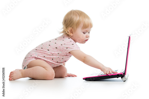 baby girl playing with laptop toy