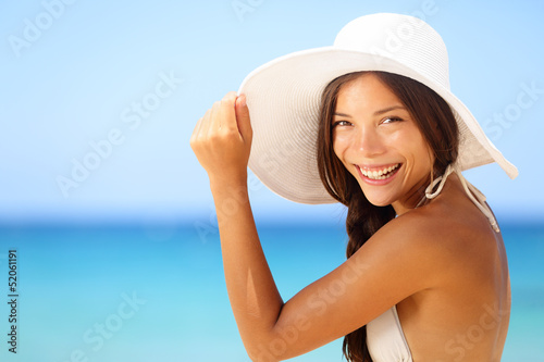 Vacation beach woman smiling happy portrait