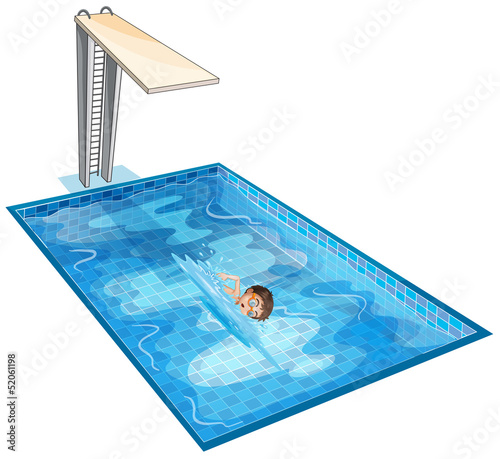 A swimming pool with a young boy