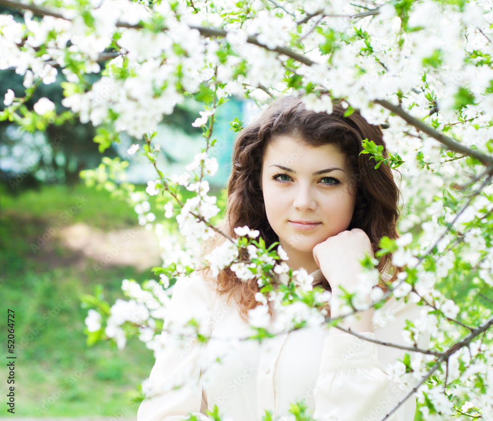 young girl in the spring garden young girl in the spring garden