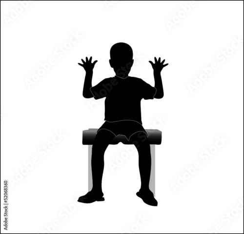 boy sitting on a chair with hands up