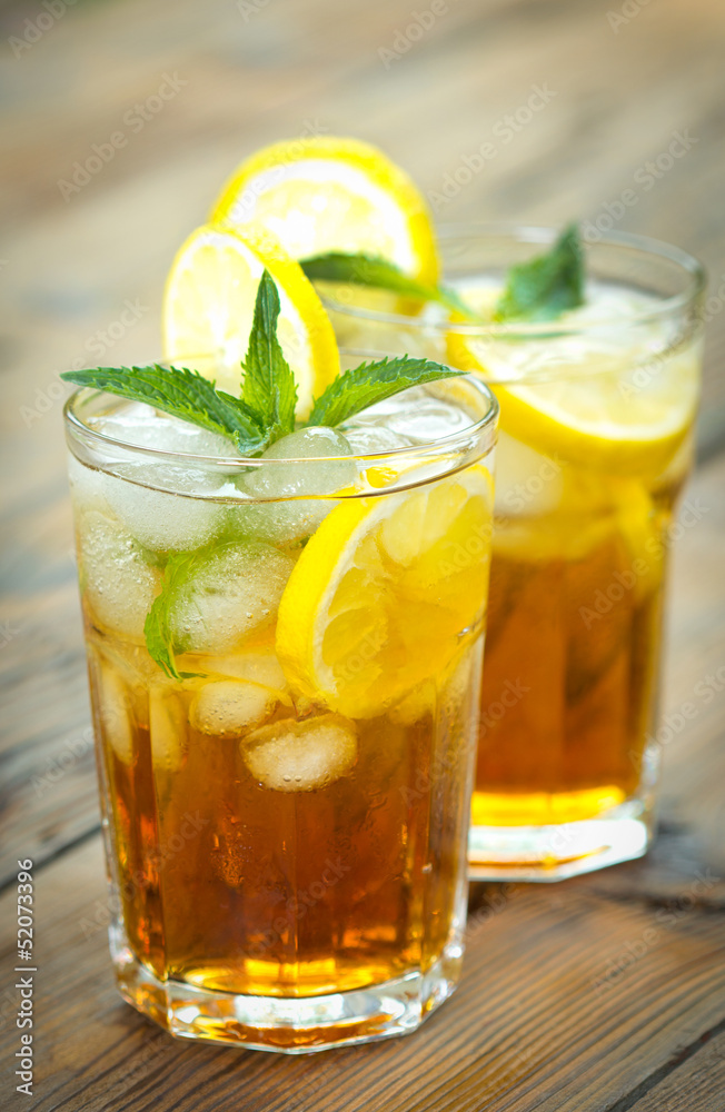 Two glasses with iced tea and lemon Two glasses with iced tea and lemon