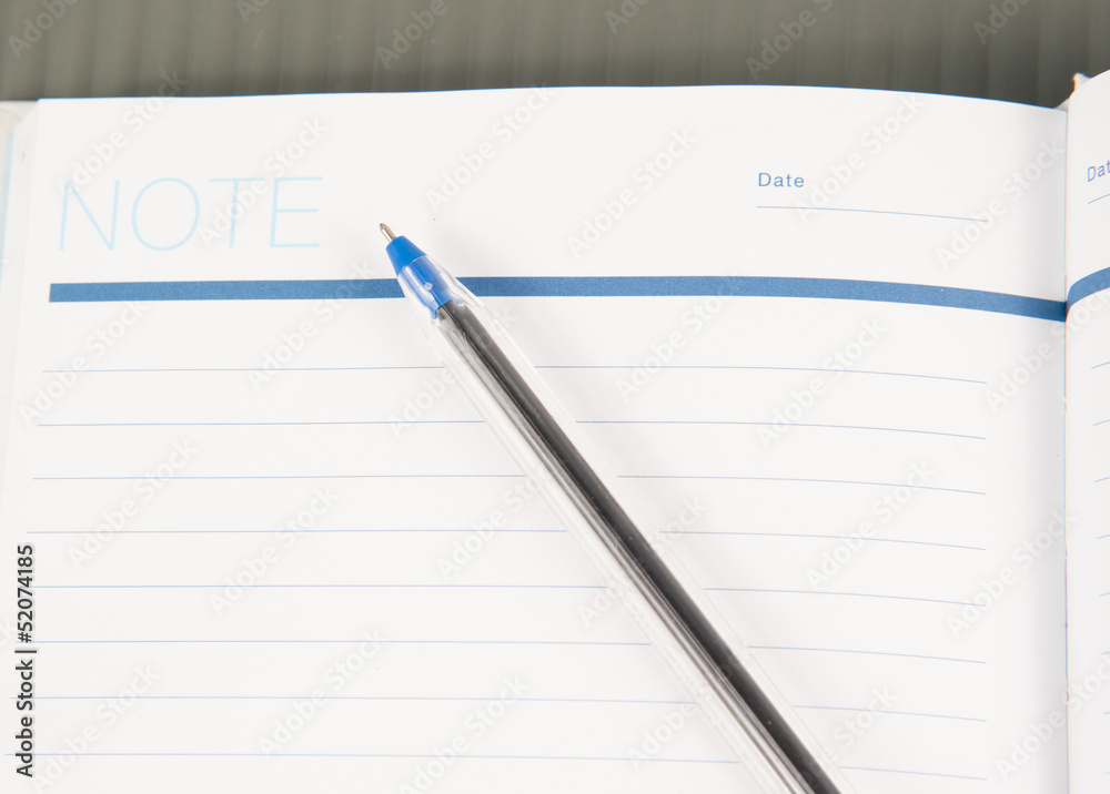 Open note book with lined pages free date space and ballpoint pe Open note book with lined pages free date space and ballpoint pe