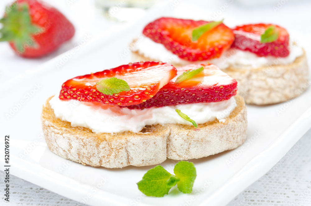 bruschetta with goat cheese, fresh strawberries and mint