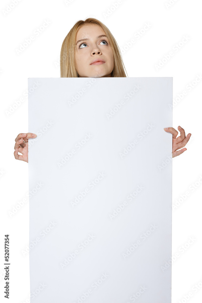 Teenage girl holding blank banner and looking up Teenage girl holding blank banner and looking up