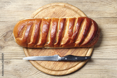 Loaf of white bread and knife