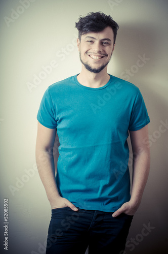 portrait of stylish young man with blue shirt