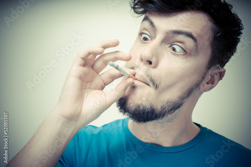 stylish young modern man with cigarette