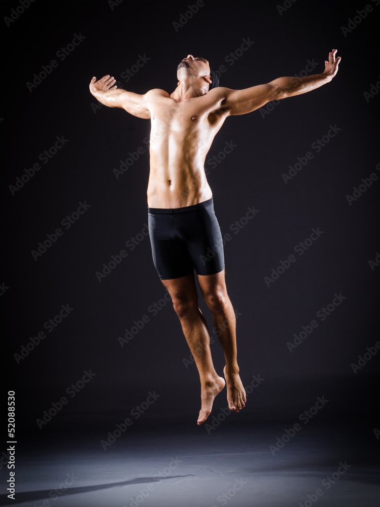 Dancer dancing in the dark studio Dancer dancing in the dark studio