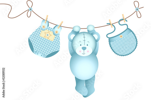 Teddy bear baby boy hanging on a clothesline