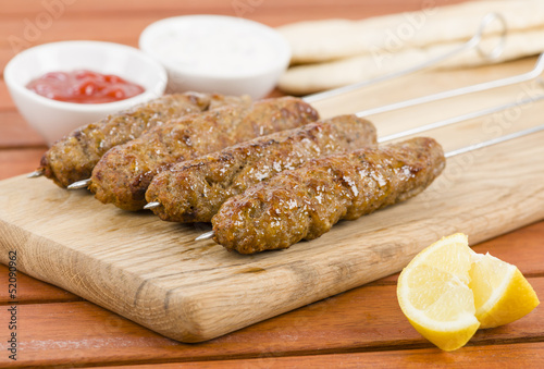 Seekh Kebabs - Minced meat kebabs on metal skewers