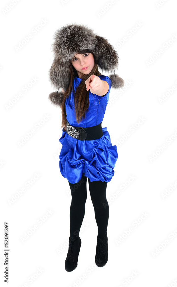 angry nice girl in fur hat showing something with point finger