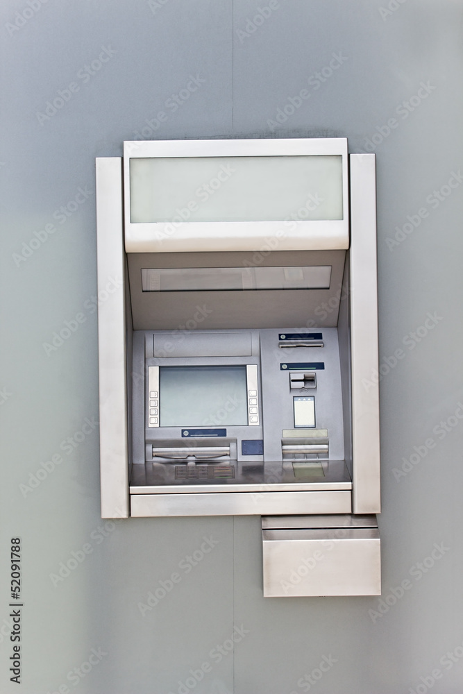 Cash dispense on metallic wall Cash dispense on metallic wall