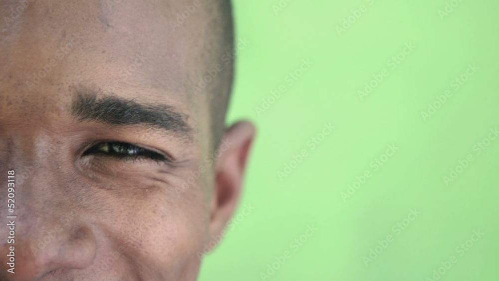 Portrait of happy young black man looking at camera and smiling