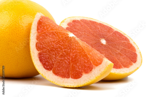 Cut grapefruit isolated on white background