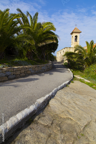 Little church with palms and sidewalk, Bordighera © ziche77