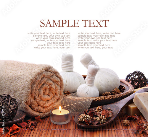 Spa massage border with rolled towel and compress balls