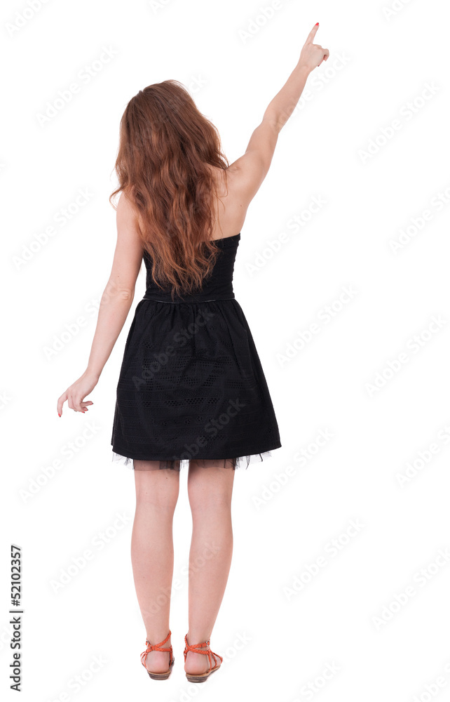 Back view of pointing woman. Back view of pointing woman.