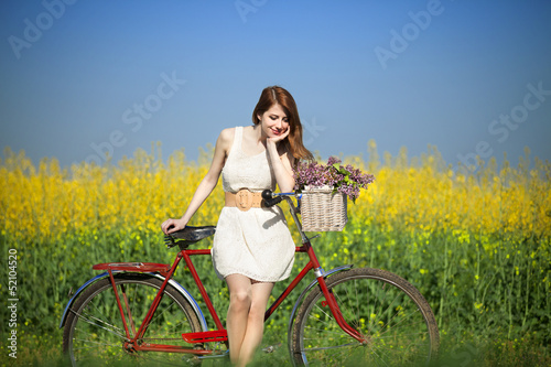 Girl on a bike in the countryside © Masson